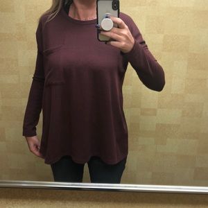 Super cute maroon top with open back.